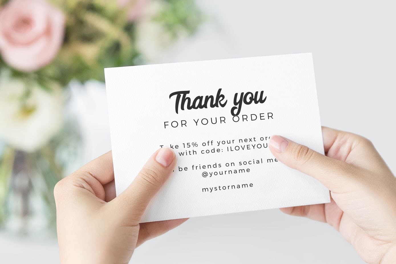 Thank-you insert card with a discount code and social media contact details